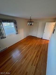 2840 Brian Dr, Parma, OH 44134 - unfurnished dining area featuring a chandelier and wood finished floors