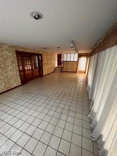 2840 Brian Dr, Parma, OH 44134 - hallway featuring wallpapered walls and light tile patterned flooring