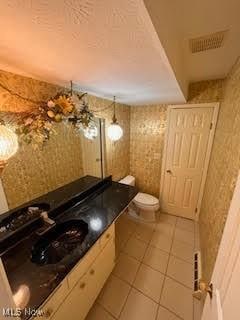 2840 Brian Dr, Parma, OH 44134 - bathroom featuring toilet, tile patterned floors, and a sink
