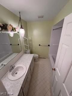 2840 Brian Dr, Parma, OH 44134 - full bath featuring vanity, toilet, and tile patterned flooring