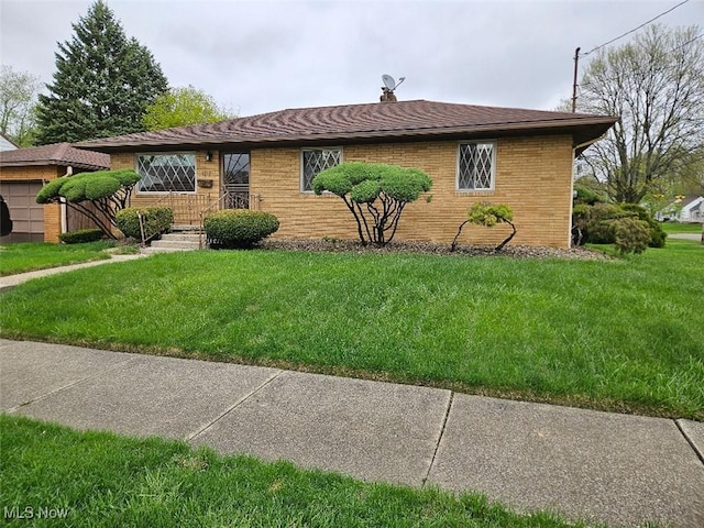 1217 Ada St, Akron, OH 44306 - view of front of house featuring a front lawn