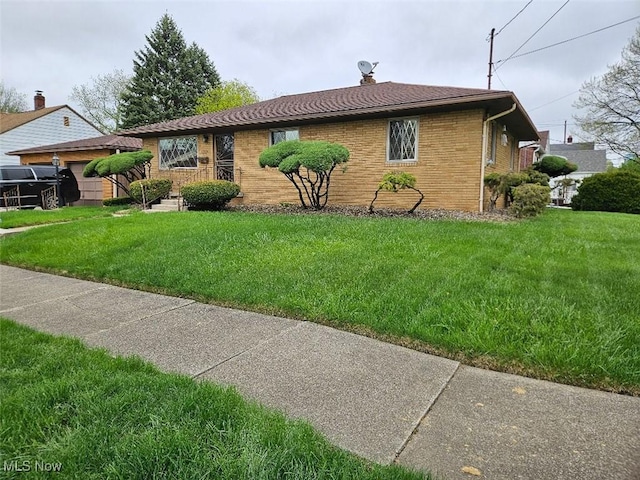 1217 Ada St, Akron, OH 44306 - view of home's exterior with a lawn and brick siding