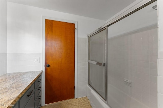 3005 Algonquin Dr, Poland, OH 44514 - full bathroom with bath / shower combo with glass door, vanity, and tile patterned floors