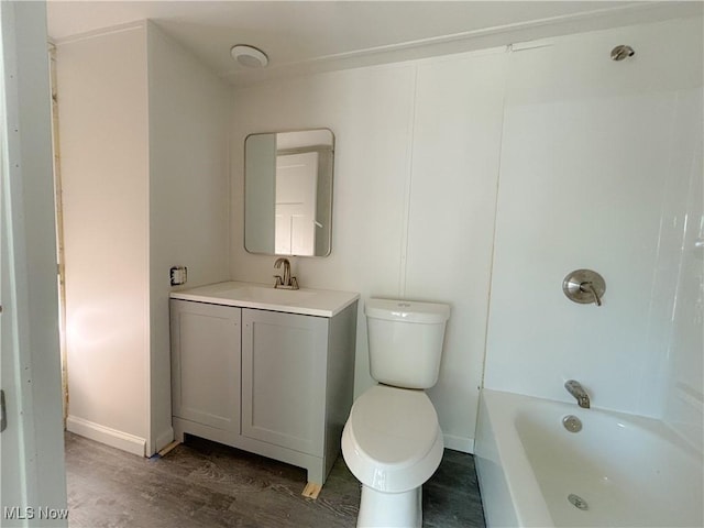 11 Redwood Dr, Beloit, OH 44609 - full bathroom with wood finished floors, toilet, baseboards, vanity, and shower / bath combination