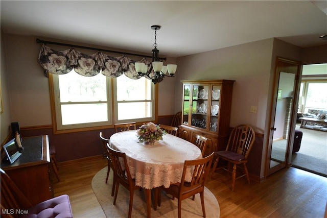 2724 Spitler Rd, Poland, OH 44514 - dining area with a chandelier and light wood-style flooring