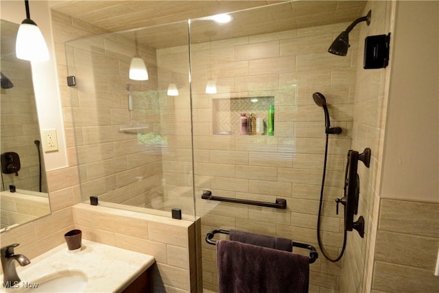 2724 Spitler Rd, Poland, OH 44514 - bathroom with tiled shower, vanity, and tile walls