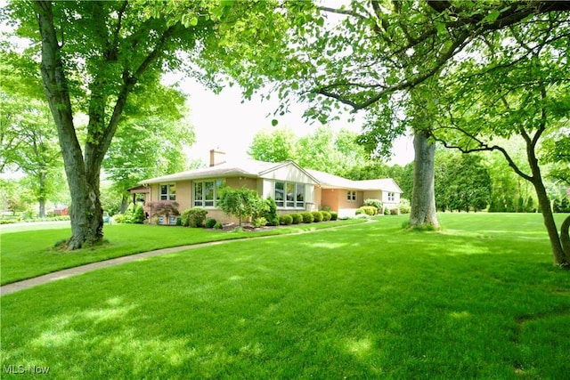 2724 Spitler Rd, Poland, OH 44514 - ranch-style home featuring a front lawn and a chimney