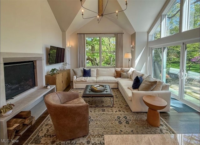 22099 Shaker Blvd, Shaker Heights, OH 44122 - living room with a chandelier, wood finished floors, a high end fireplace, and high vaulted ceiling