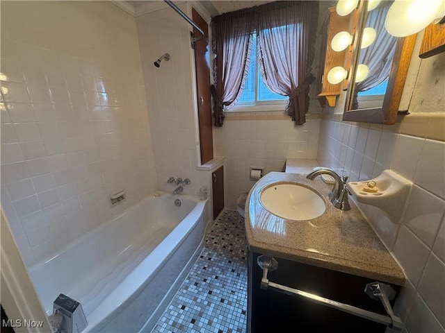 1707 Clairmont Ave, Cambridge, OH 43725 - bathroom featuring tile patterned floors, vanity, tile walls, and bathtub / shower combination