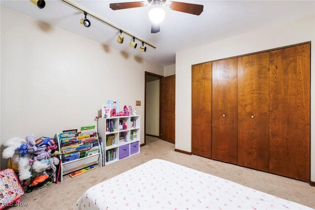 500 Stoneybrook Ln, Canfield, OH 44406 - bedroom with carpet floors, track lighting, a closet, and ceiling fan