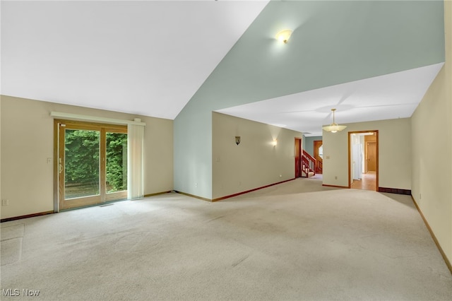33 Brandon Pl, Rocky River, OH 44116 - carpeted empty room featuring baseboards, stairs, and vaulted ceiling