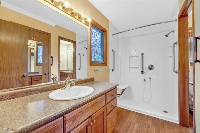 33 Brandon Pl, Rocky River, OH 44116 - bathroom featuring walk in shower, wood finished floors, vanity, and toilet