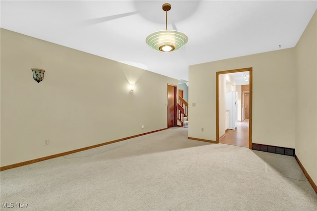 33 Brandon Pl, Rocky River, OH 44116 - empty room with light colored carpet, baseboards, and stairway