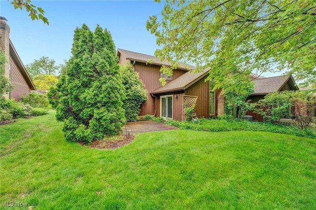 33 Brandon Pl, Rocky River, OH 44116 - rear view of house featuring a yard and board and batten siding