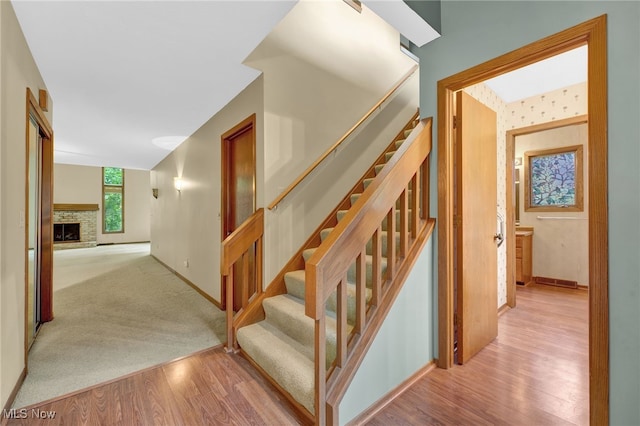 33 Brandon Pl, Rocky River, OH 44116 - stairway with wood finished floors, baseboards, and a fireplace