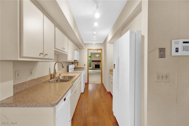 33 Brandon Pl, Rocky River, OH 44116 - kitchen with white appliances, a sink, wood finished floors, and light countertops