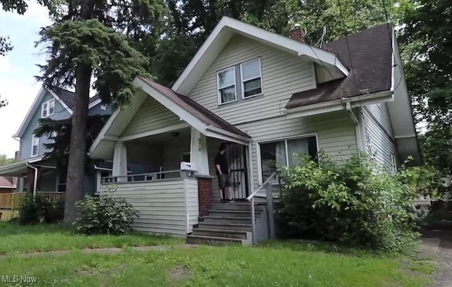 978 Delia Ave, Akron, OH 44320 - bungalow-style home featuring covered porch, a chimney, and a shingled roof