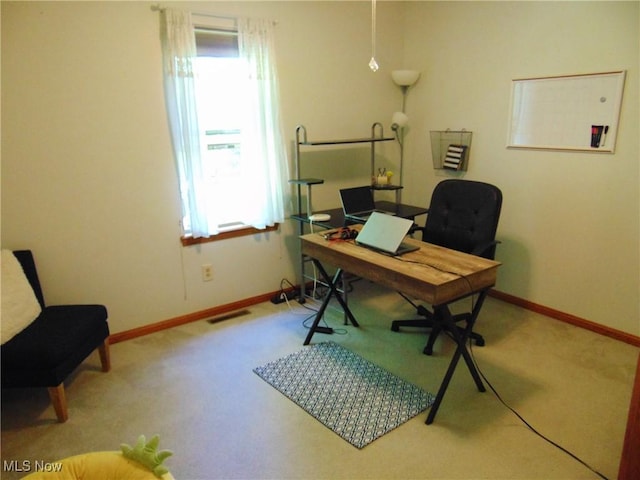 home office featuring carpet and baseboards