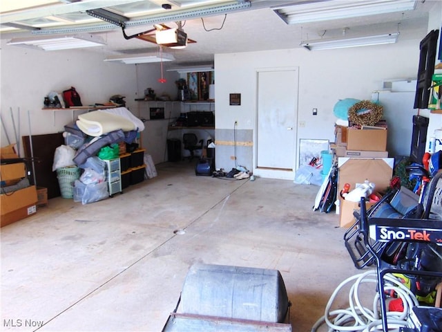 garage featuring a garage door opener