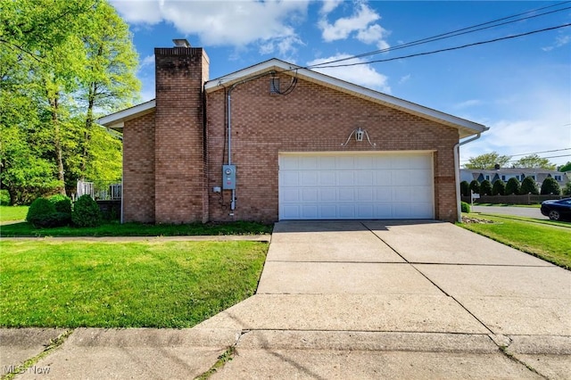 128 E Circle Dr, Weirton, WV 26062 - view of home's exterior featuring a chimney, a yard, brick siding, an attached garage, and driveway