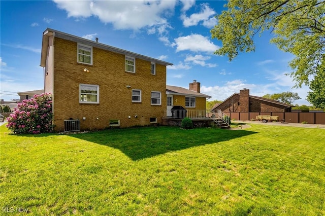 128 E Circle Dr, Weirton, WV 26062 - back of house with a wooden deck, brick siding, cooling unit, and a chimney