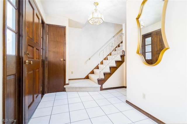 128 E Circle Dr, Weirton, WV 26062 - entrance foyer featuring stairway, a chandelier, baseboards, and light tile patterned flooring