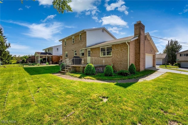 128 E Circle Dr, Weirton, WV 26062 - rear view of house with a chimney, a yard, brick siding, and driveway