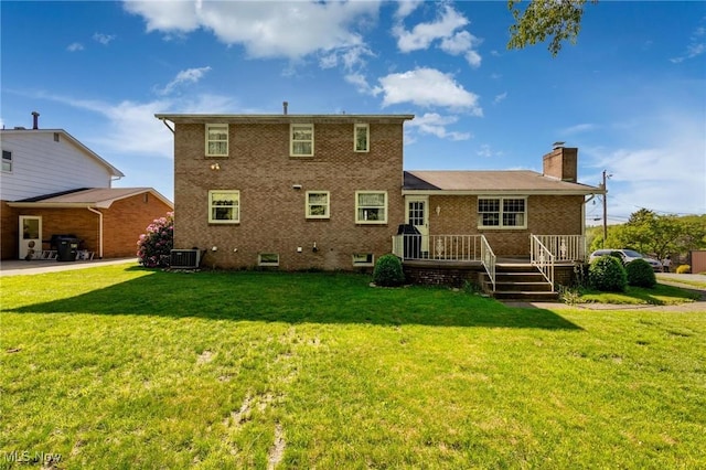 128 E Circle Dr, Weirton, WV 26062 - back of house featuring brick siding, a lawn, a chimney, and a wooden deck