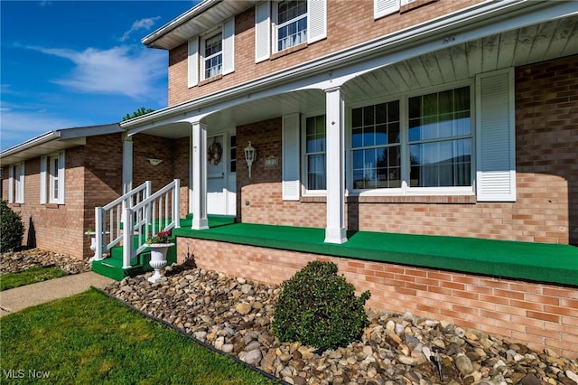128 E Circle Dr, Weirton, WV 26062 - view of side of property with brick siding and a porch