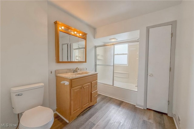520 Lincoln Blvd, Steubenville, OH 43952 - bathroom featuring wood finished floors, toilet, vanity, and combined bath / shower with glass door
