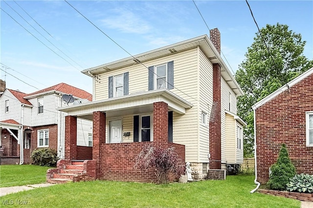 520 Lincoln Blvd, Steubenville, OH 43952 - view of front of home with a chimney, covered porch, a front lawn, and brick siding