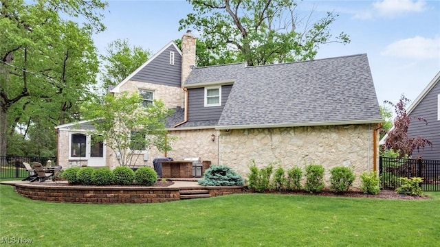 1251 Marwood Dr, Zanesville, OH 43701 - rear view of property featuring stone siding, a chimney, a shingled roof, and a patio