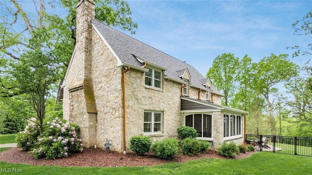1251 Marwood Dr, Zanesville, OH 43701 - rear view of house featuring stone siding, a sunroom, a chimney, and roof with shingles