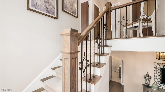 1251 Marwood Dr, Zanesville, OH 43701 - stairs with arched walkways and wood finished floors