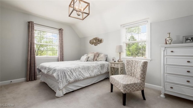 1251 Marwood Dr, Zanesville, OH 43701 - bedroom featuring lofted ceiling, light carpet, baseboards, and a chandelier