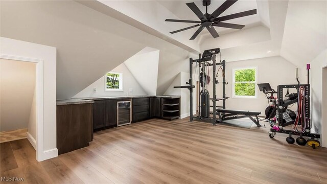 1251 Marwood Dr, Zanesville, OH 43701 - exercise area featuring beverage cooler, lofted ceiling, light wood-style flooring, baseboards, and ceiling fan