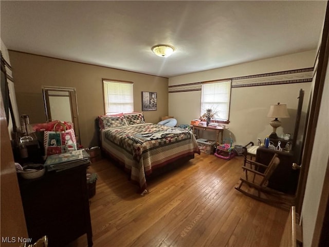 567 Westfield Rd, East Liverpool, OH 43920 - bedroom with wood-type flooring and multiple windows