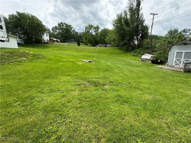 567 Westfield Rd, East Liverpool, OH 43920 - view of grassy yard featuring a storage unit and an outbuilding