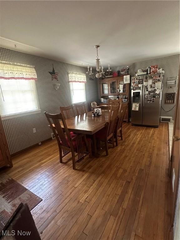 567 Westfield Rd, East Liverpool, OH 43920 - dining space featuring wallpapered walls, a chandelier, and hardwood / wood-style floors