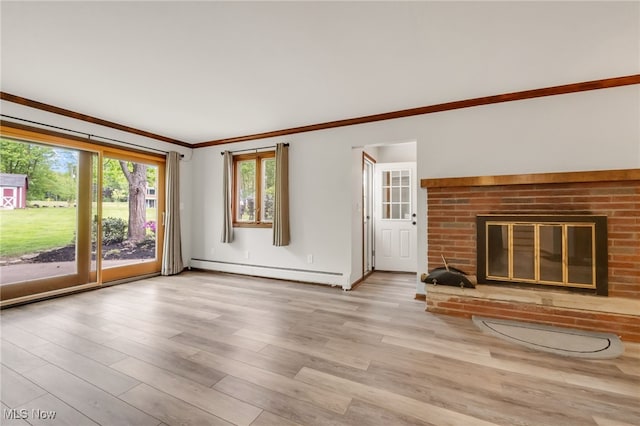 7456 Blue Ridge Dr, Mentor, OH 44060 - unfurnished living room featuring baseboard heating, ornamental molding, light wood-style floors, a brick fireplace, and baseboards