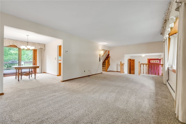 7456 Blue Ridge Dr, Mentor, OH 44060 - unfurnished living room featuring a baseboard radiator, carpet flooring, a chandelier, baseboards, and stairs