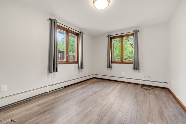 7456 Blue Ridge Dr, Mentor, OH 44060 - unfurnished room with healthy amount of natural light, light wood-style flooring, and baseboards