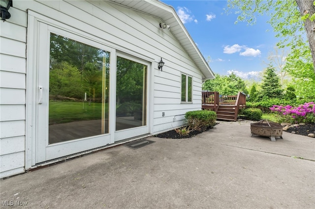 7456 Blue Ridge Dr, Mentor, OH 44060 - view of patio / terrace with an outdoor fire pit and a deck