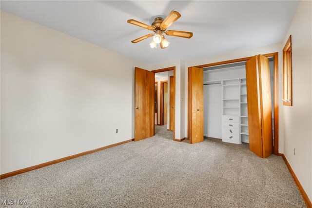 7456 Blue Ridge Dr, Mentor, OH 44060 - unfurnished bedroom with carpet flooring, baseboards, a closet, and a ceiling fan