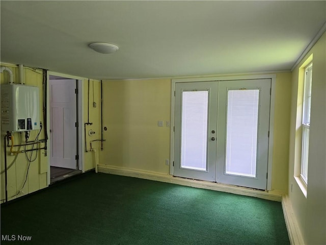 355 N Elm Ave, Tallmadge, OH 44278 - entryway featuring water heater, dark carpet, french doors, and baseboards