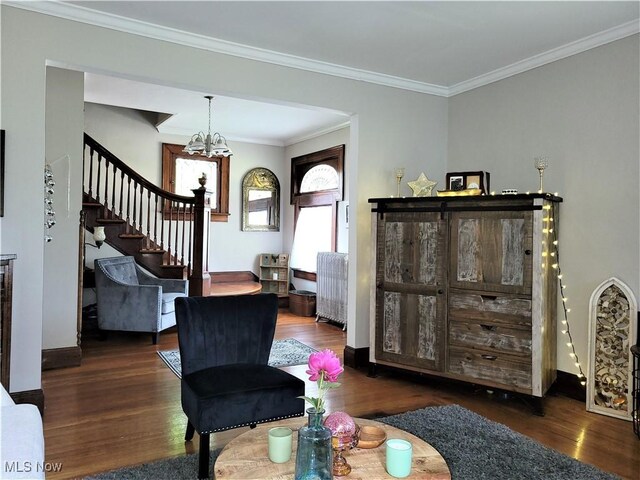 517 N 10th St, Cambridge, OH 43725 - living room featuring stairs, wood finished floors, a chandelier, ornamental molding, and baseboards