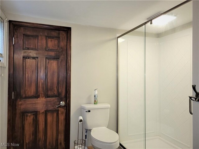 517 N 10th St, Cambridge, OH 43725 - full bathroom featuring a shower stall and toilet