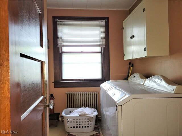 517 N 10th St, Cambridge, OH 43725 - washroom featuring radiator, cabinet space, and separate washer and dryer