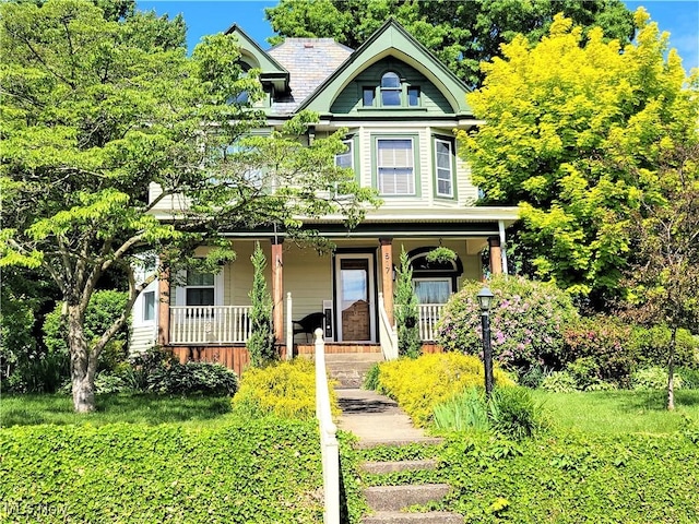 517 N 10th St, Cambridge, OH 43725 - victorian-style house with covered porch