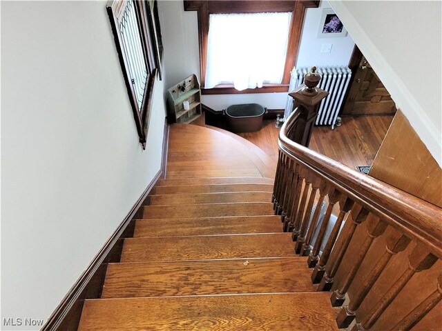 517 N 10th St, Cambridge, OH 43725 - staircase featuring wood finished floors, radiator, and baseboards